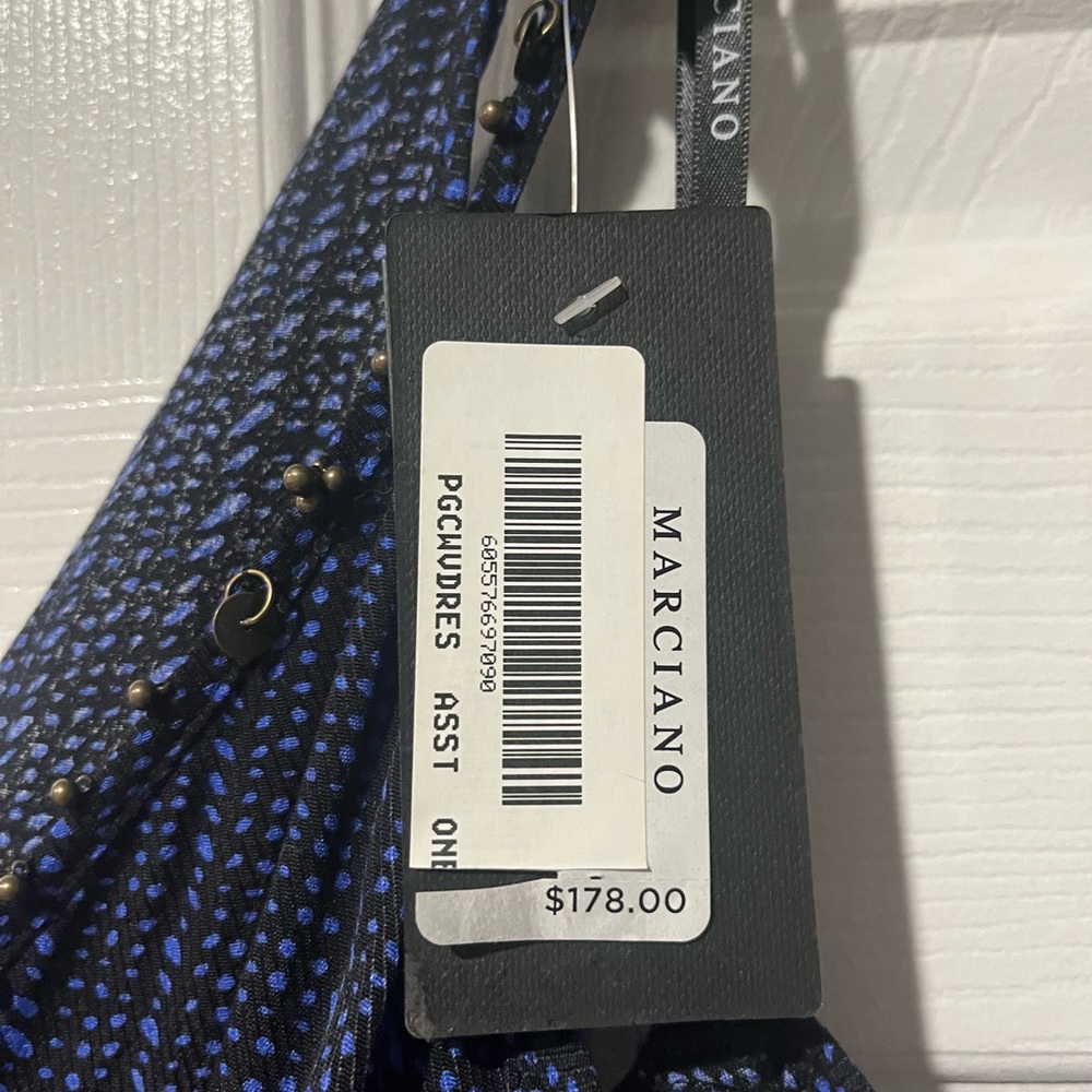 Navy blue jumper with tags.